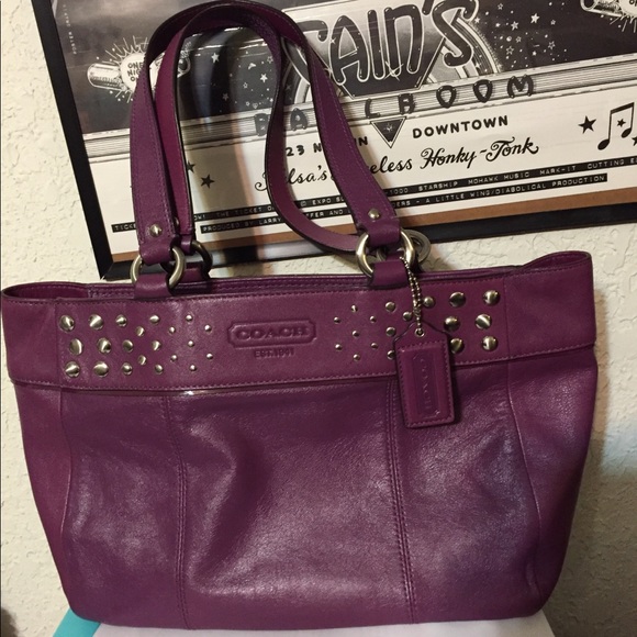Coach Handbags - A leather burgundy Coach satchel with studs